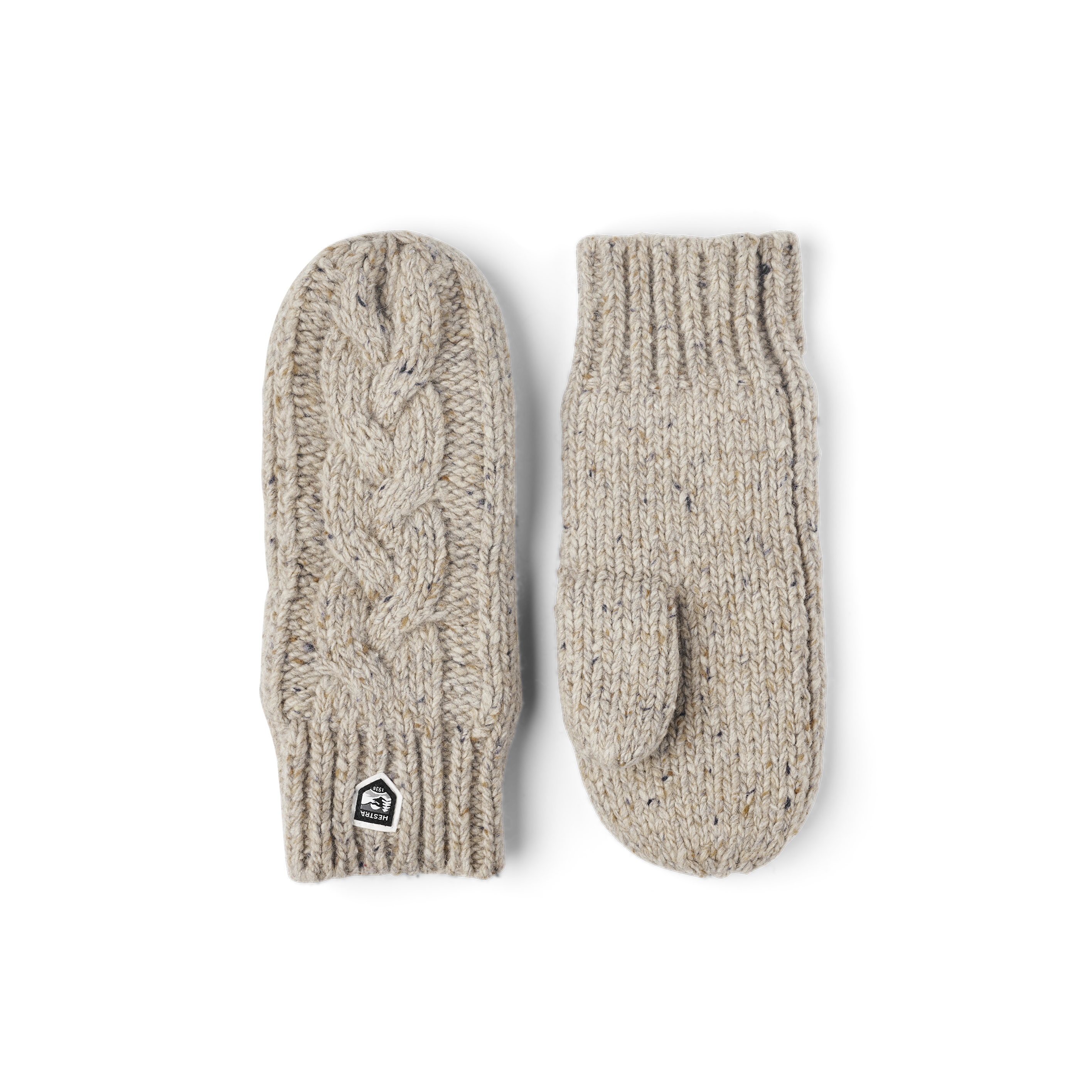 Beige stickad tumvante i melerat garn av merinoull