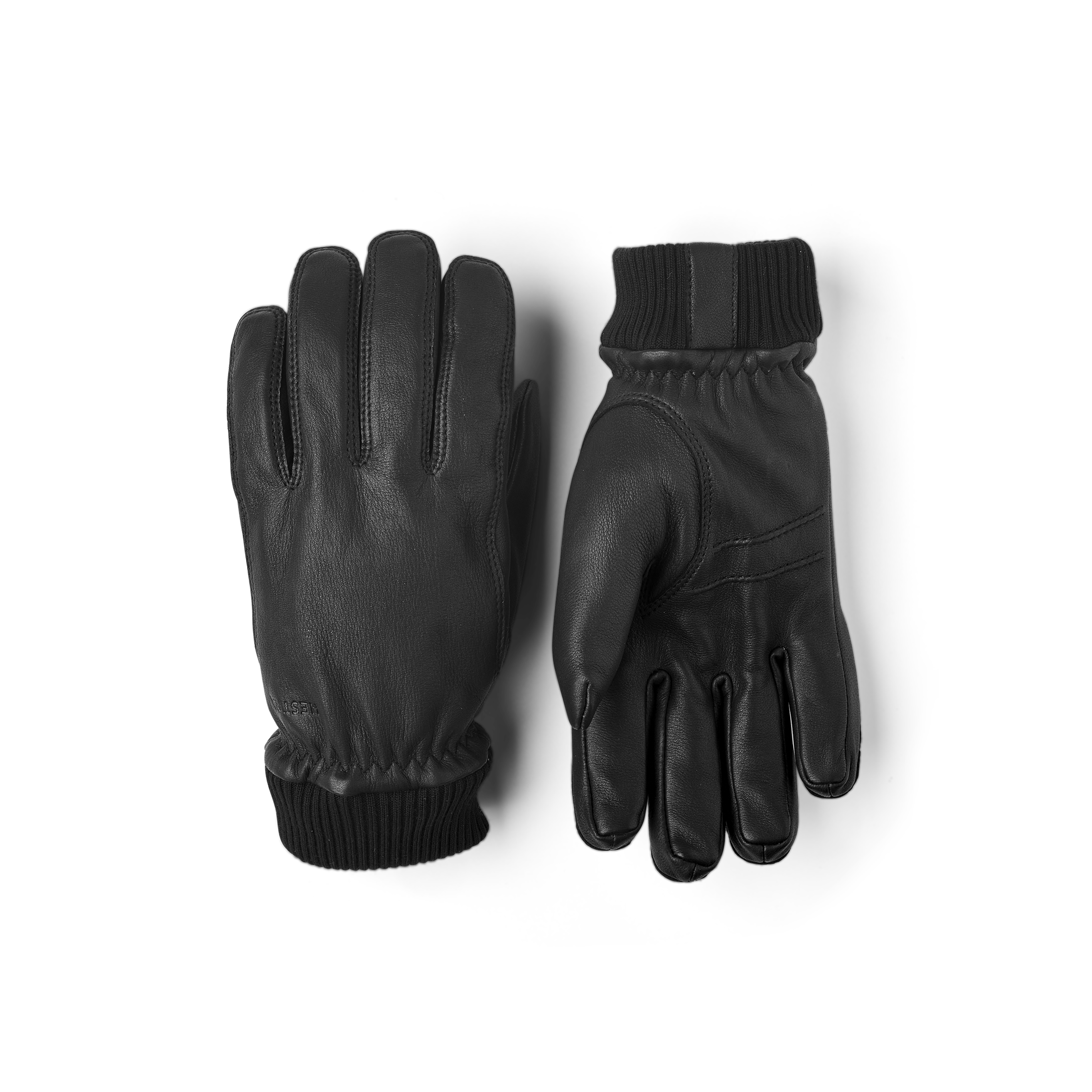 Svart maskinsydd handske i hjortskinn med stickad mudd