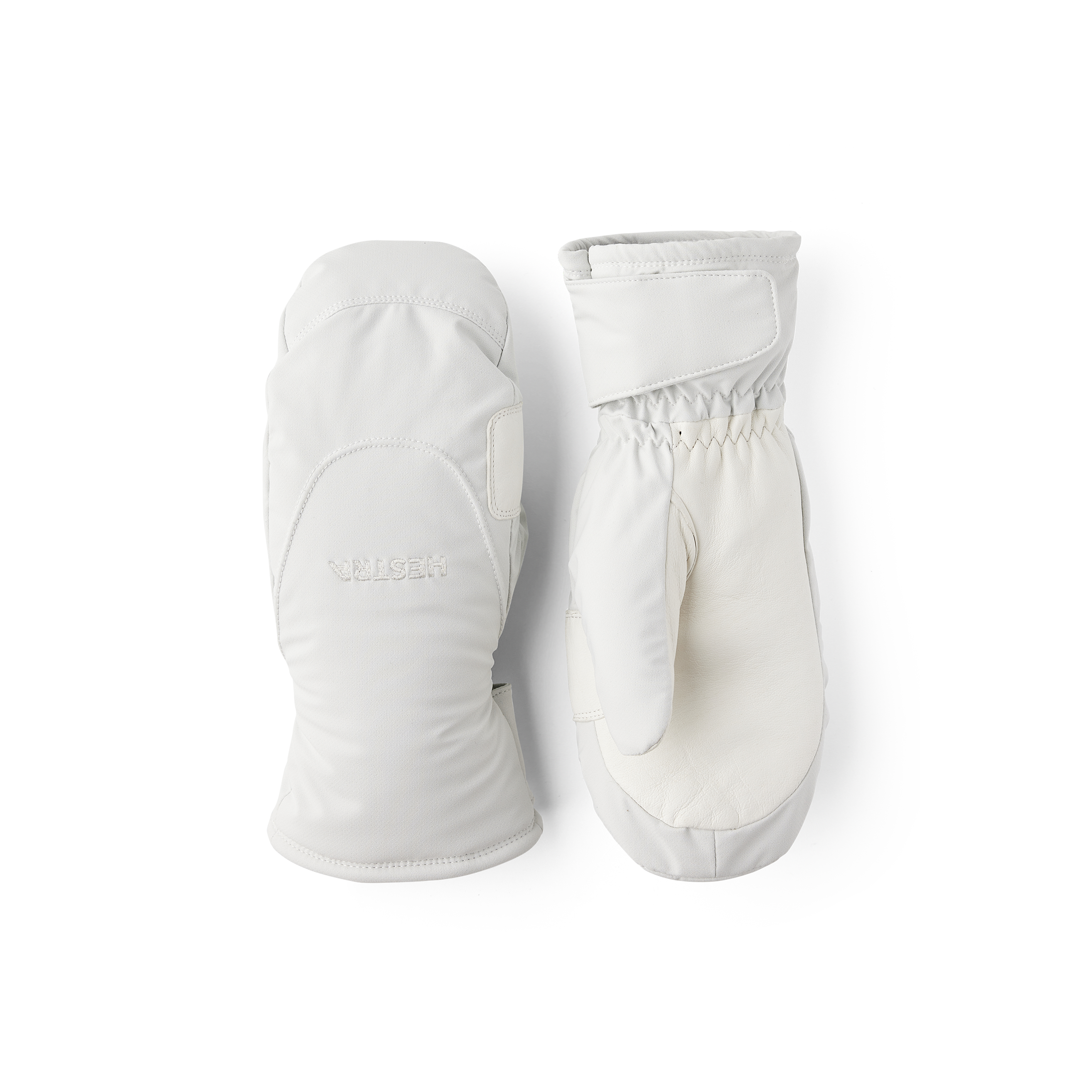 Vit tumhandske i tyg med vit lammnappa i innerhanden