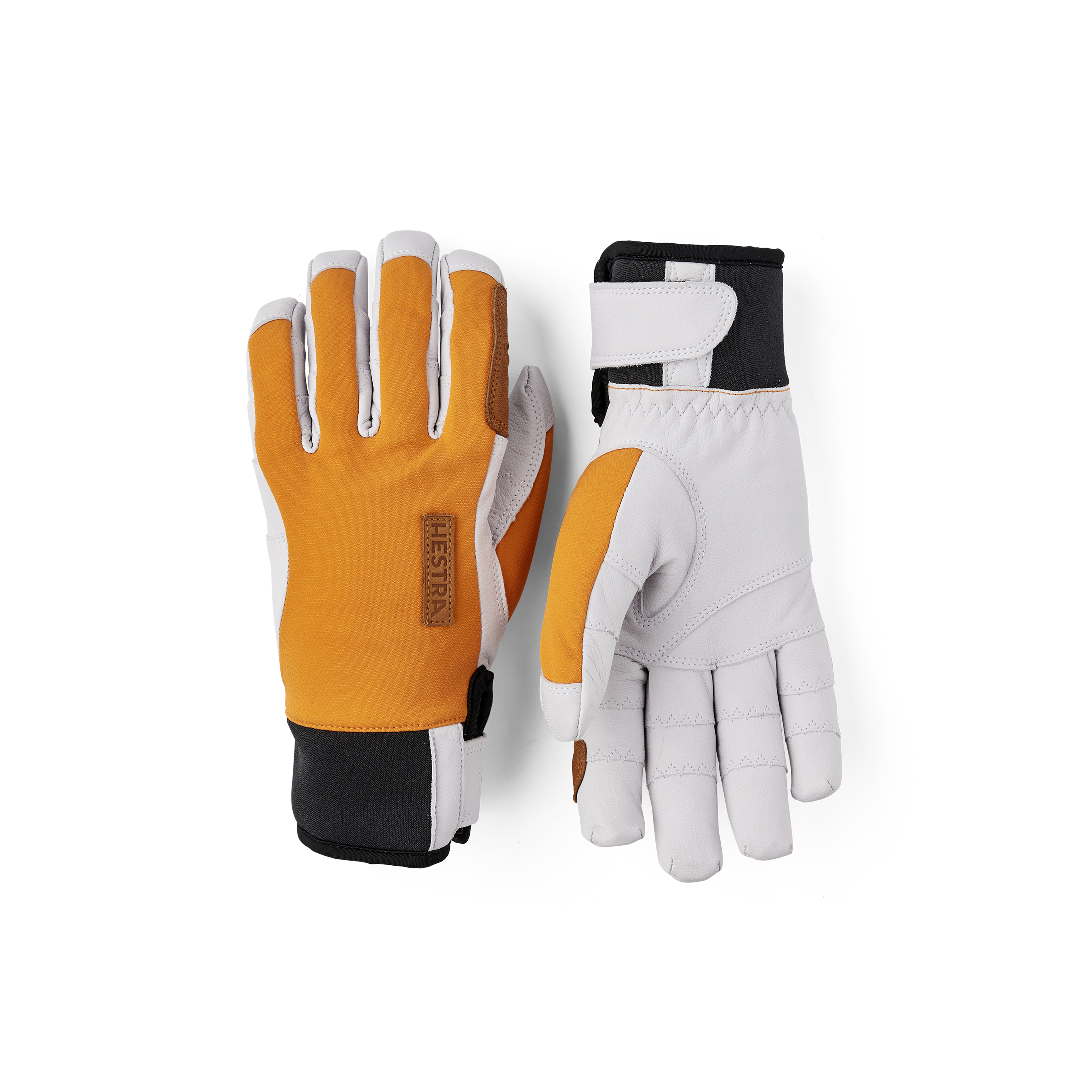 Orange handske med vitt getskinn i innerhanden